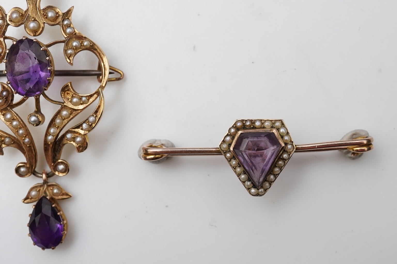 An Edwardian amethyst and seed pearl pendant and bar brooch, early 20th century